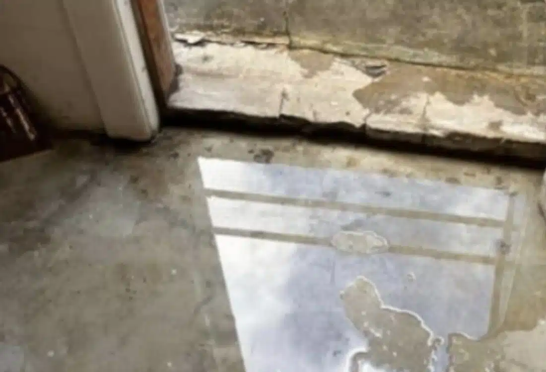 Leaky basement floor before waterproofing in Winchester, VA.