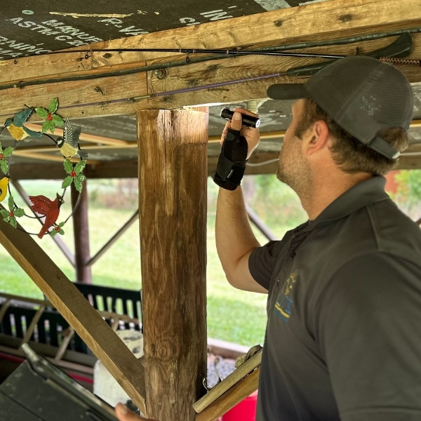 LUX team performing a crawl space inspection to identify structural risks and high crawl space moisture levels in Berkeley, WV.