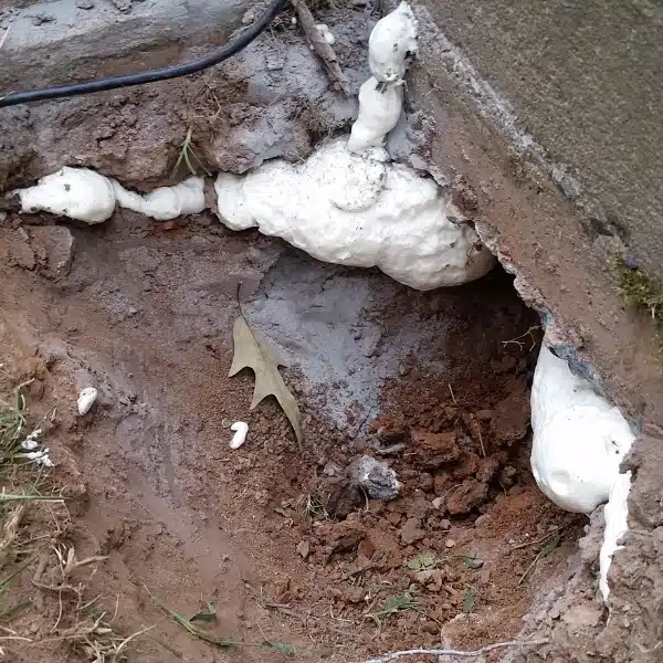 Foundation void filled with polyurethane foam to strengthen support, preventing exceeding support capacity in Linden, VA.