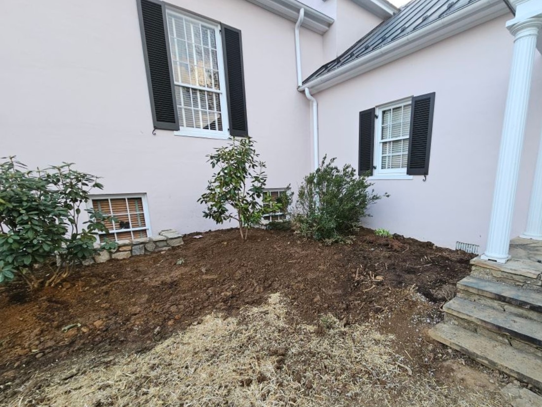 Landscaping and exterior finishes restored after exterior waterproofing in Bristow, VA, maintaining the home’s curb appeal.