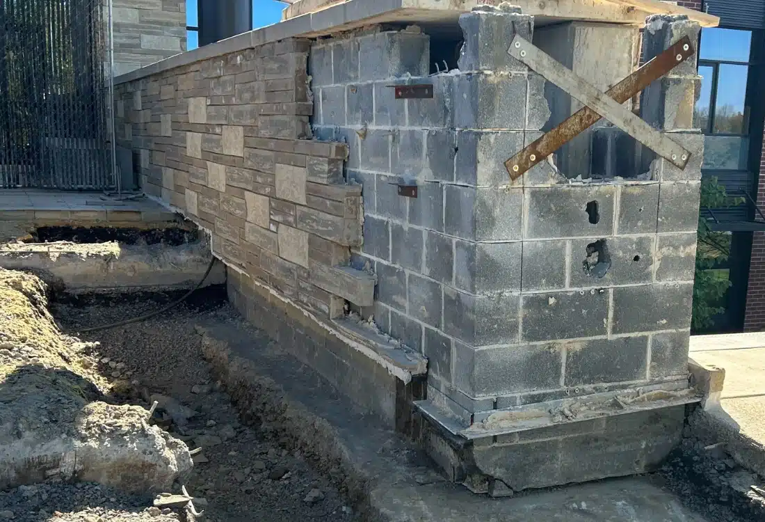 Unstable supports wall before retaining wall stabilization in White Post, VA, showing cracks and signs of foundation movement.