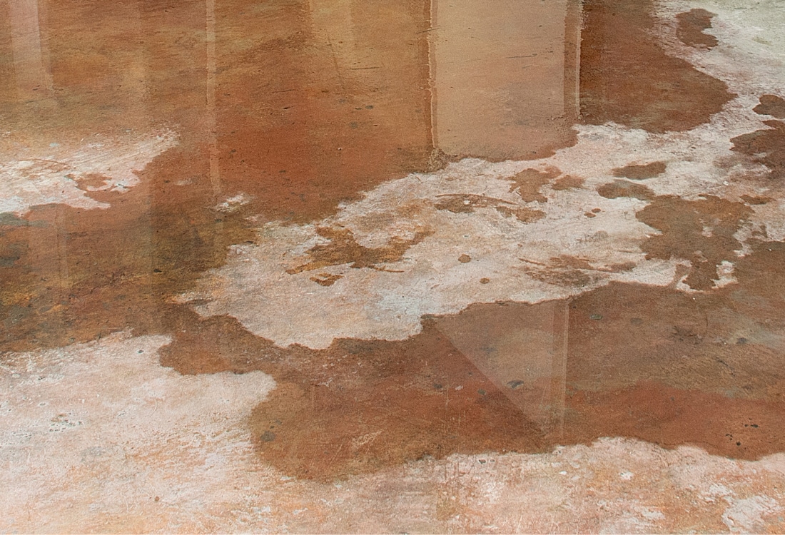 Floor water seepage caused by poor drainage that needs basement sump pump installation in Harpers Ferry, WV.