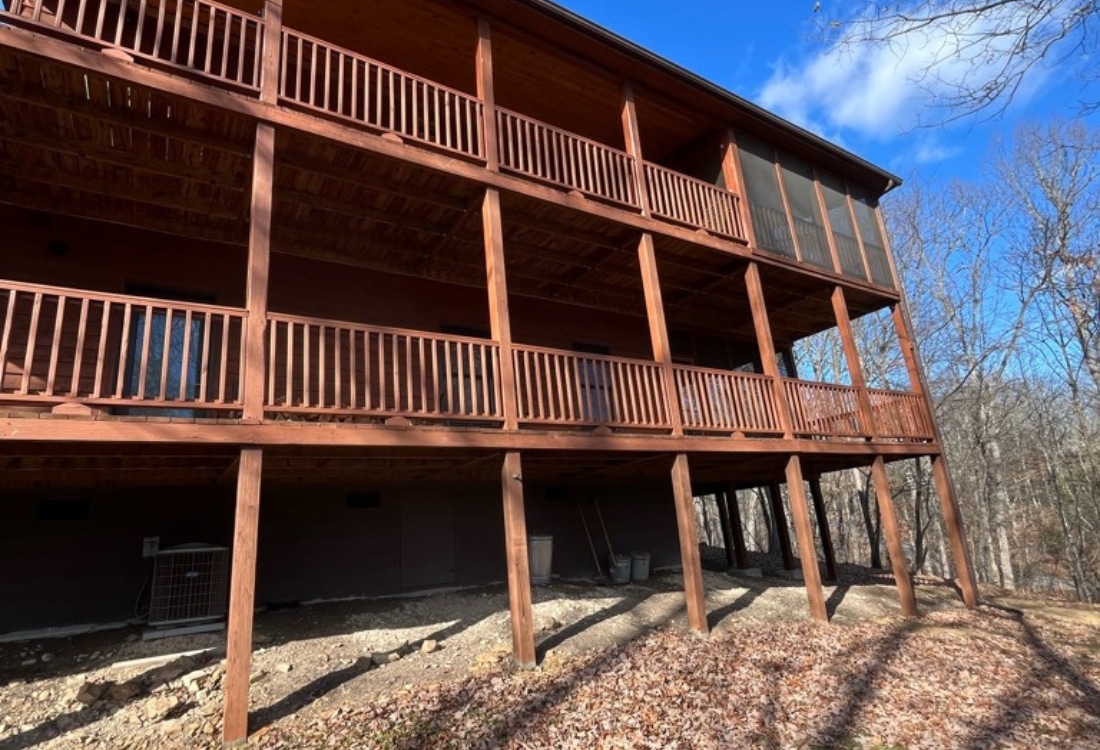 A deteriorating deck with failing wood supports before deck support posts replacement in Harpers Ferry, WV.