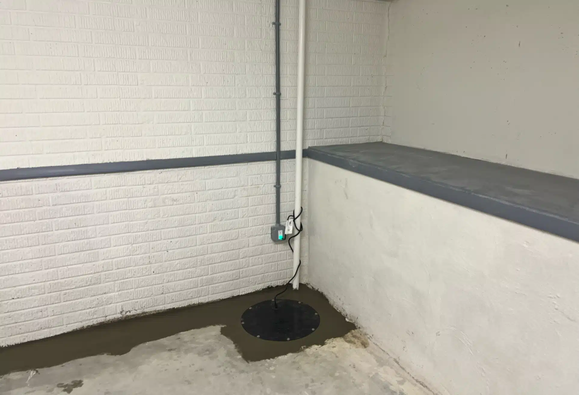 Waterproofed basement with sealed cracks after interior drainage system installation in Winchester, VA, for long-term protection.