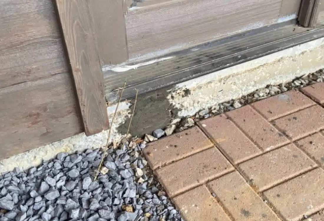 Home foundation sinking in White Post, VA, before push pier and wall pin installation, showing signs of structural instability.