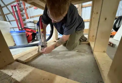 LUX team lifting an uneven floor for concrete repair services in Northern Virginia, fixing and stabilizing surfaces for safet