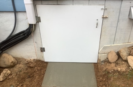 Crawl space door installation in Fairfax, VA, to effectively seal the area from moisture and outside elements.