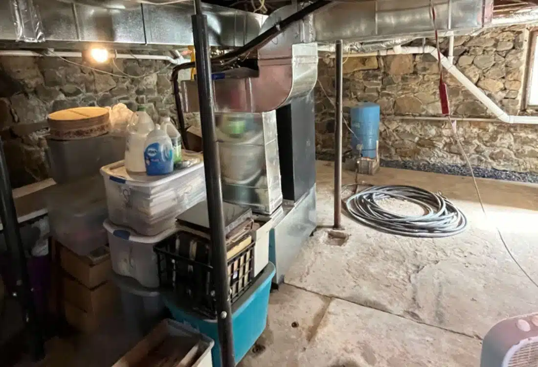 Damp, compromised utility basement before foundation repair