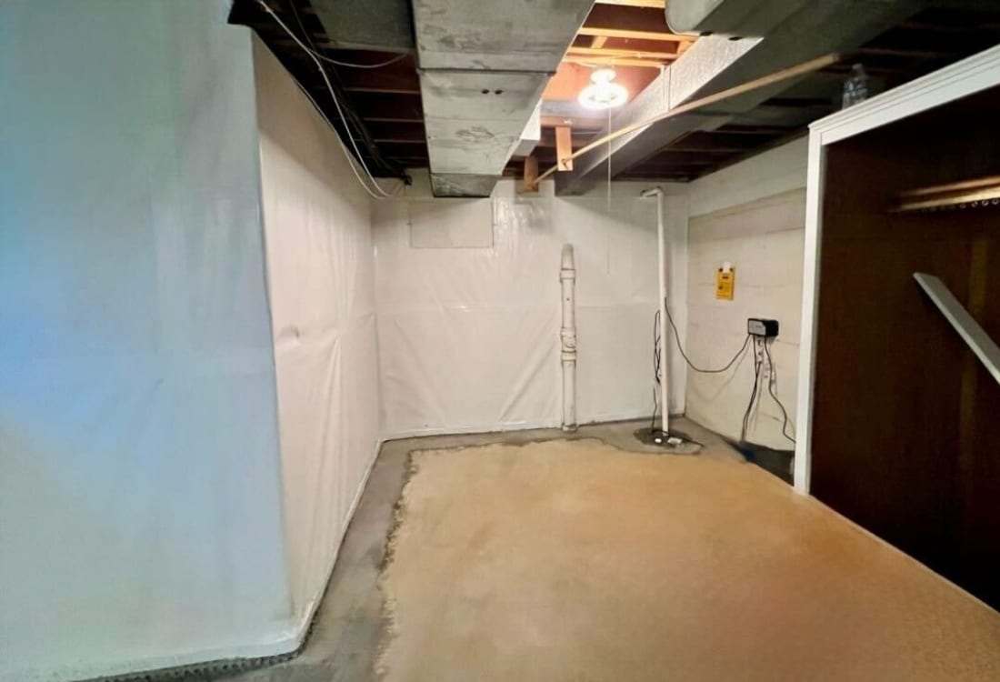 Dry, clean, moisture-free area after wet basement repair in Winchester, VA.