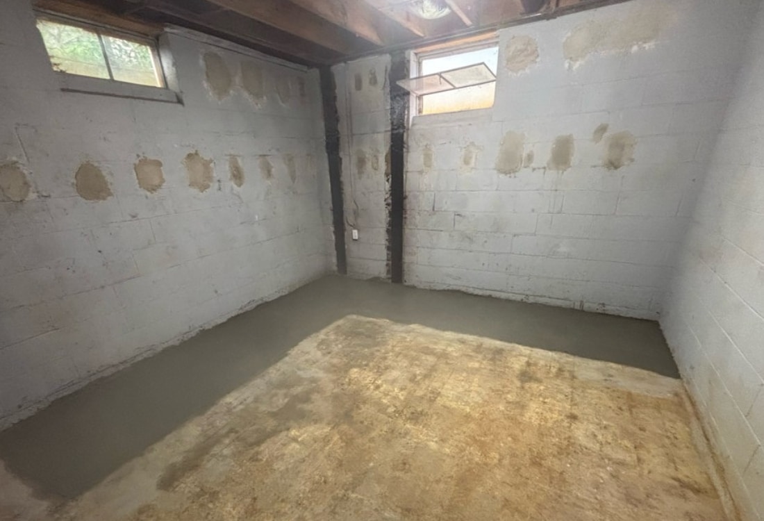 Stabilized cinder block basement walls after the successful installation of foundation wall anchors in White Post, VA
