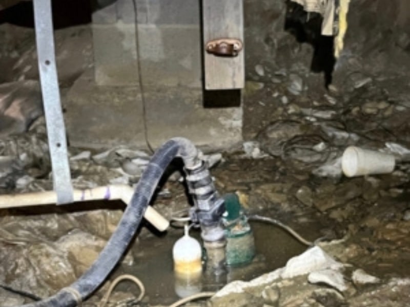 Damage and leaking pipe with line dripping water into crawl space in Strasburg, VA, creating dampness under the home.