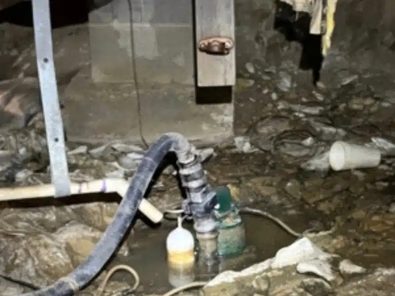 Damage and leaking pipe with line dripping water into crawl space in Strasburg, VA, creating dampness under the home.