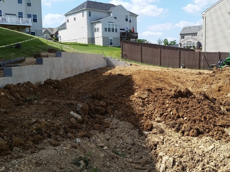 Sloping near a house foundation, a poor grading that can cause water in the crawl space in Berryville, VA.