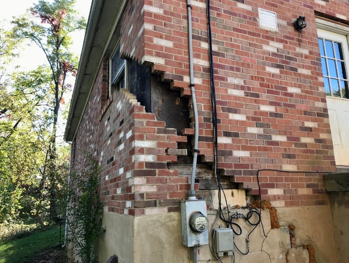 Large foundation wall crack caused by soil settlement, a common cause of damage in White Post, VA homes.