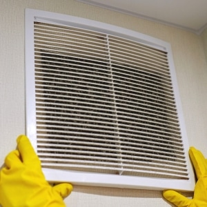 Dirty vent showing poor basement airflow that traps humidity, causes of basement wood rotting in Berryville, VA.