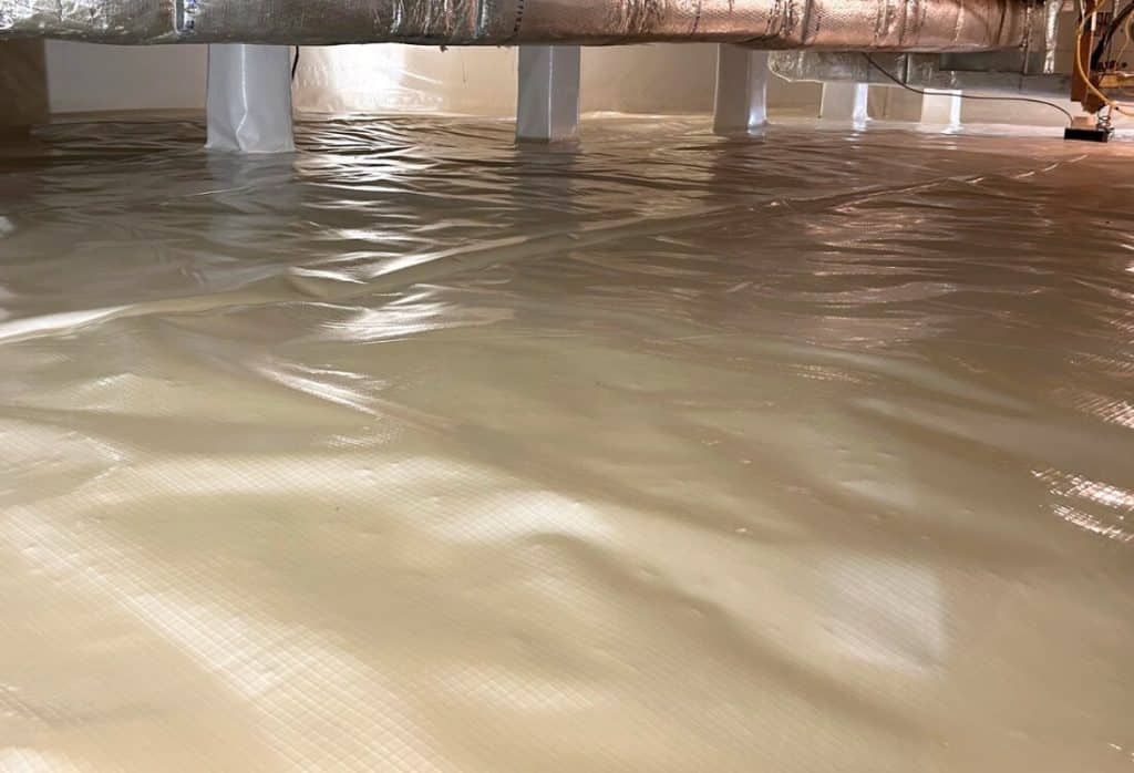 Encapsulated crawl space in Reston, VA, with sealed vapor barrier and clean flooring to keep mice out and prevent reinfestation.