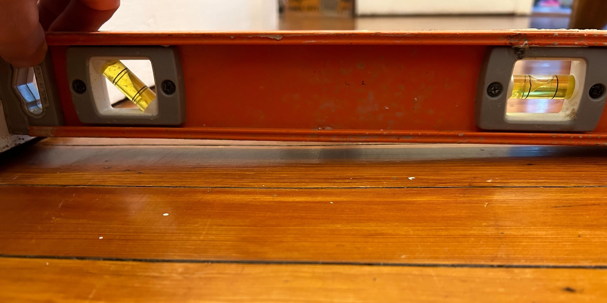 Uneven and sagging floors inside home, showing sloped flooring that explains why are my floors sagging in Northern Virginia.