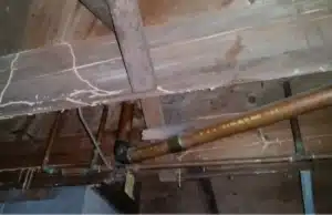 Corroded metal pipes in crawl space, signs of damp crawl space in Bristow, VA.