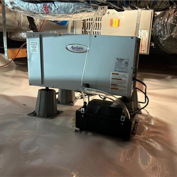 Installed crawl space dehumidifier on sealed vapor barrier controlling humidity and mold, a crawl space repair solution in Fairfax, VA.
