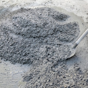 Poor quality concrete mix showing inadequate construction practices, causing sinking foundation in Flint Hill, VA.