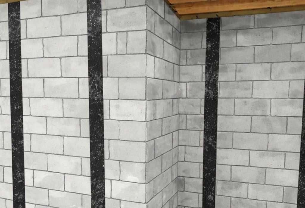 Illustration of carbon fiber strips bonded to a bowed basement wall White Post, VA, to prevent further inward movement.