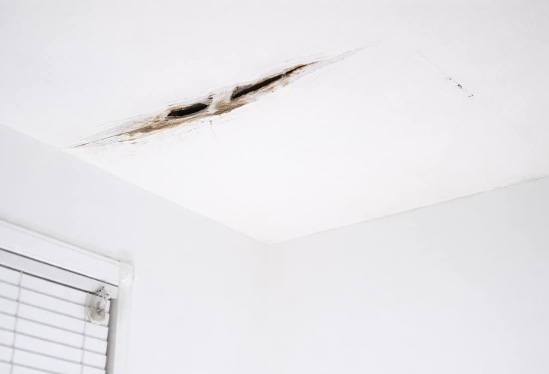 Dangerous ceiling cracks picture of sagging ceiling drywall, requiring immediate professional evaluation