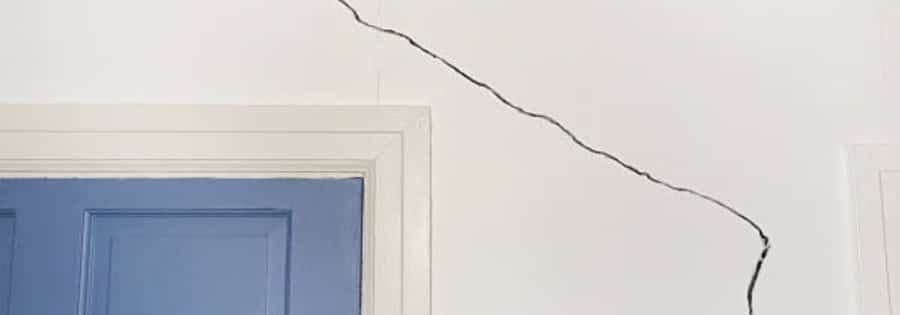 diagonal foundation crack at the corner of a basement window in Northern Virginia