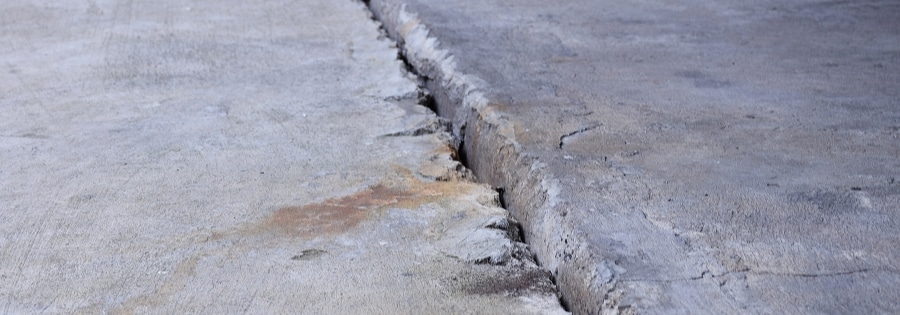 foundation slab crack showing vertical displacement in basement floor in Northern Virginia
