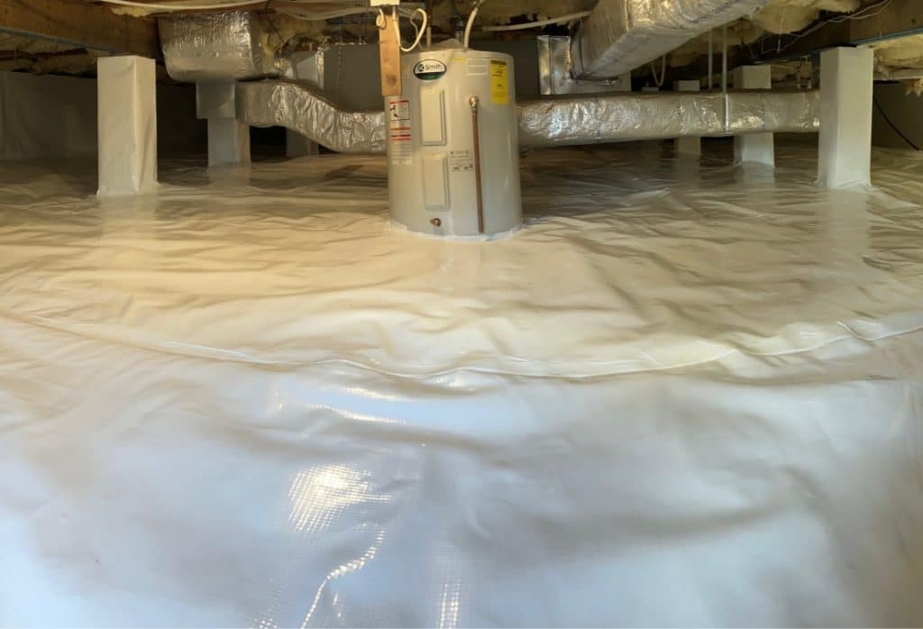 Encapsulated crawl space in Winchester, VA, with heavy duty vapor barrier covering floor and walls with HVAC equipment and a support column.