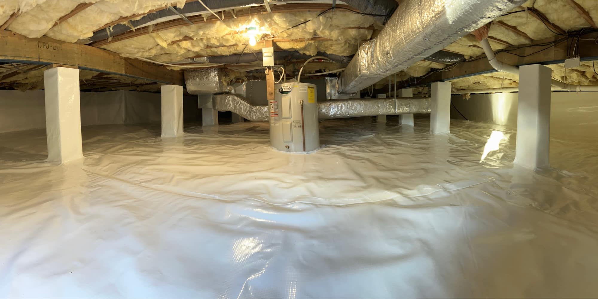 Encapsulated area with vapor barrier on floor and walls of showing vented vs encapsulated crawl space difference in Northern Virginia.