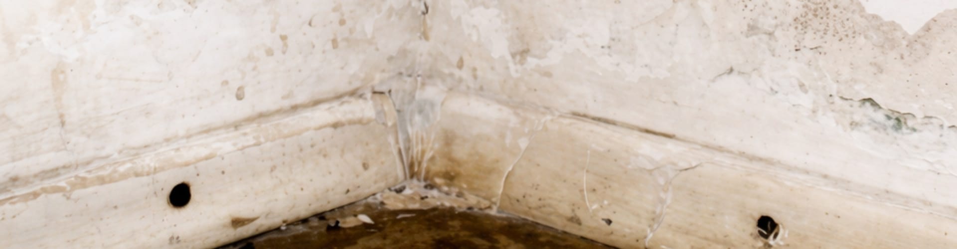 Water stains on basement walls and floor in a Northern Virginia home showing signs of basement problem.