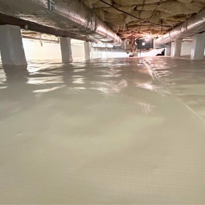 Fully encapsulated crawl space with vapor liner covering floor and walls eliminating musty crawl space smell in Brambleton, VA.