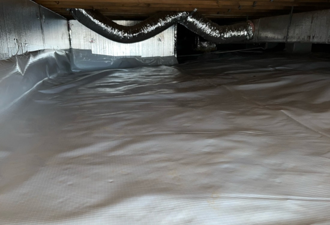 Completed crawl space encapsulation system with drainage, dehumidifier after crawl space water damage repair in Culpeper, VA.