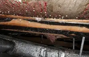 Condensation forming on crawl space pipes, a sign of wet crawl space insulation problem in Harpers Ferry, WV.