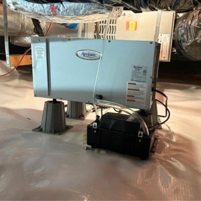 Aprilaire crawl space dehumidifier installed on encapsulated floor to control high crawl space humidity in Harpers Ferry, WV.