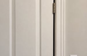 Visible gap along a door frame inside a home caused by shifting foundation, a sign of sticking doors in Brambleton, VA.