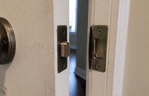 Misaligned door latch and strike plate in a home, a sign of sticking doors that no longer close properly in Southbridge, VA.