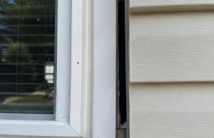 Gap between window frame and siding, a sign of foundation settlement problem in Berryville, VA.