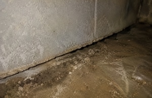 Gap between the crawl space foundation wall and floor, sign of crack in crawl space foundation wall problem in Manassas, VA.