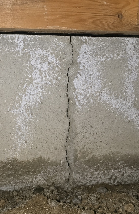 Close-up view showing the size and severity of a crack in crawl space foundation wall in Winchester, VA.
