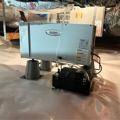 Professionally installed crawl space dehumidifier maintaining low humidity to prevent crawl space pest activity in Manassas, VA.