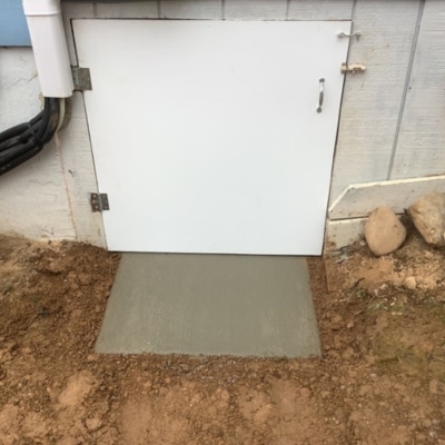 Sealed crawl space door with insulated PVC installed blocking pest entry points in Charles Town, WV.