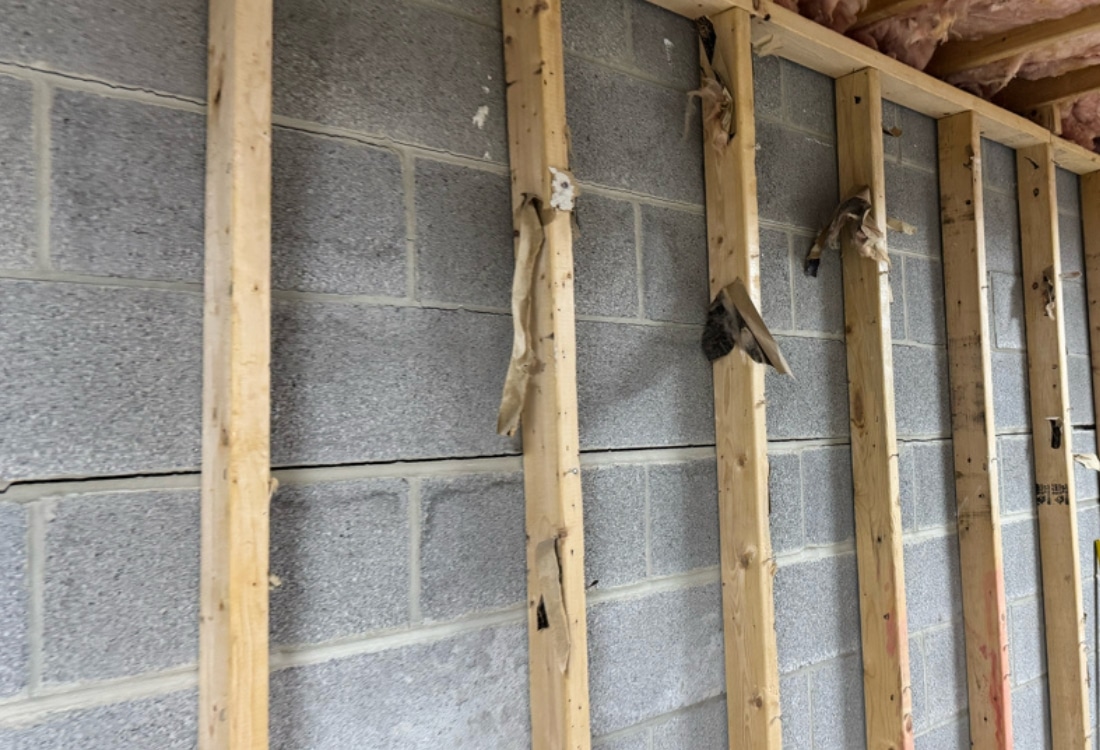 Horizontal and stair-step cracks on concrete block foundation wall discovered during home inspection in Winchester, VA.