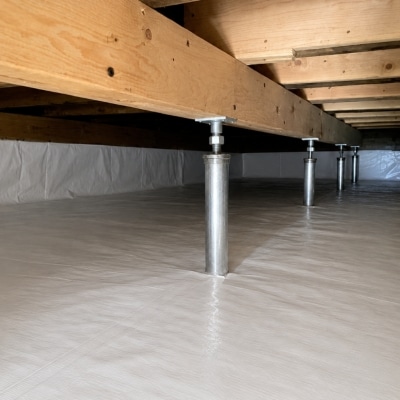 Adjustable steel support posts installed under floor joist, a sagging floor above the crawl space solution in Strasburg, VA.