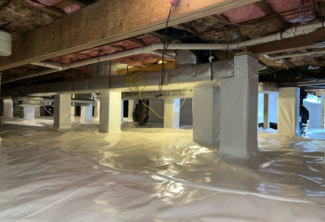 Fully encapsulated crawl space with wrapped columns in a Shepherdstown, WV home.