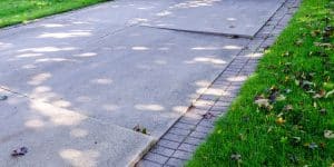 Cracked concrete driveway showing a need for concrete driveway crack repair in Northern VA.