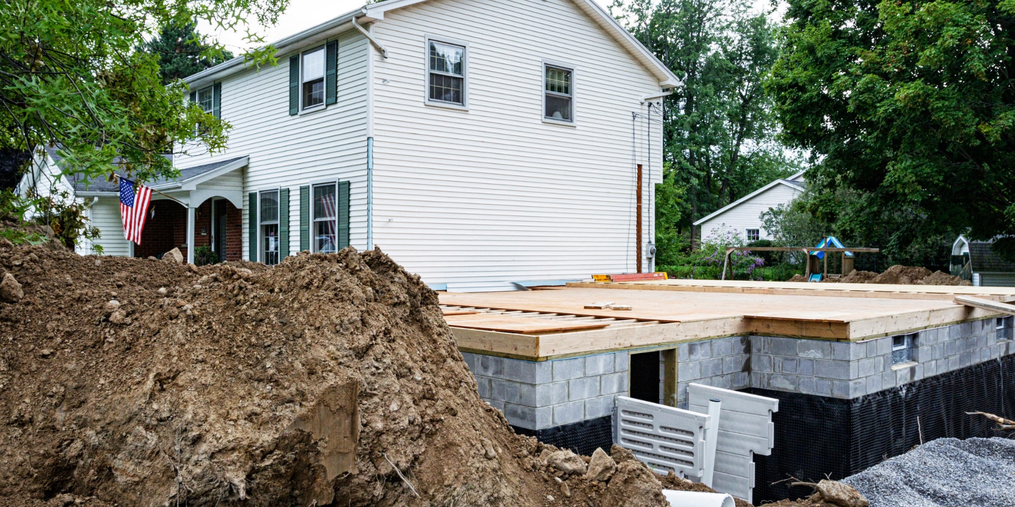 Home addition under construction beside an existing foundation in Northern Virginia.