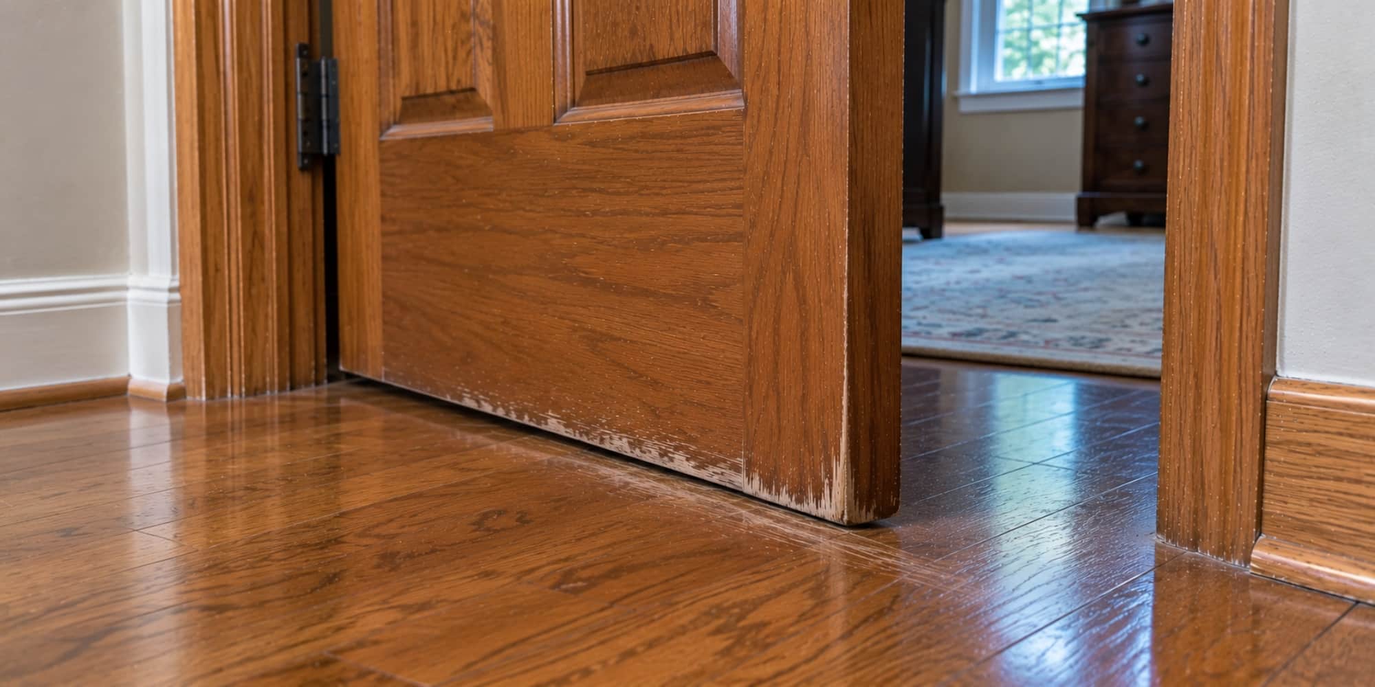 A sticking door with a visible gap at the frame, a common sign of foundation movement that causes door sticking again in Northern, VA.