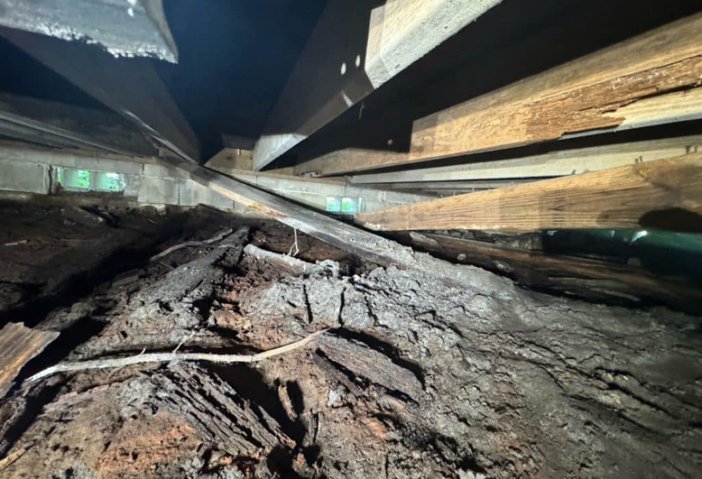 Rotted and damaged wood framing showing signs a crawl space needs waterproofing in White Post, VA.
