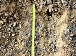 Targeted digging ensures accurate post placement for structural support.